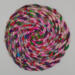 This vibrant multicolored trivet is approximately 8 inches round.  This vibrant multicolored trivet is approximately 8 inches round.